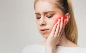 patient suffering from tmj pain